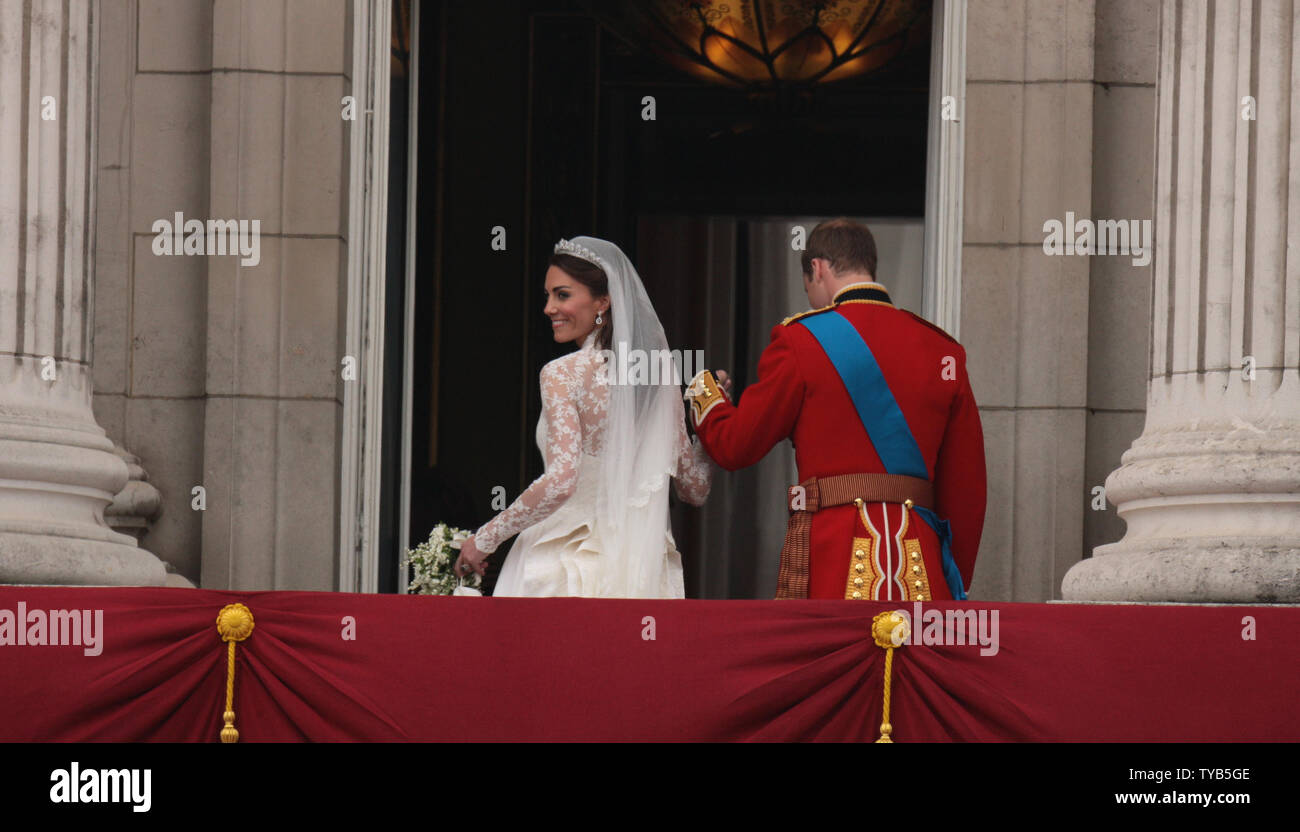 Prince William leads Princess Catherine inside Buckingham Palace after their wedding at Westminster Abbey on April 29, 2011 The Royal couple will now be known as the Duke and Duchess of Cambridge.    UPI /HugoPhilpott Stock Photo