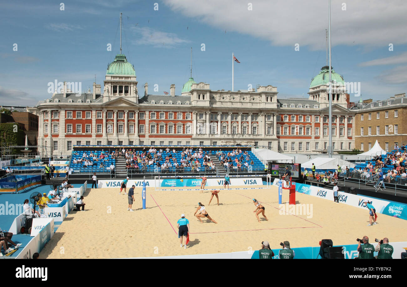 Members of the American Olympic beach volleyball team in action against