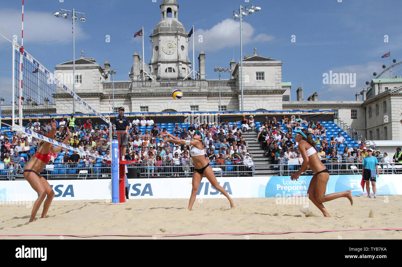 Members of the American Olympic beach volleyball team in action against