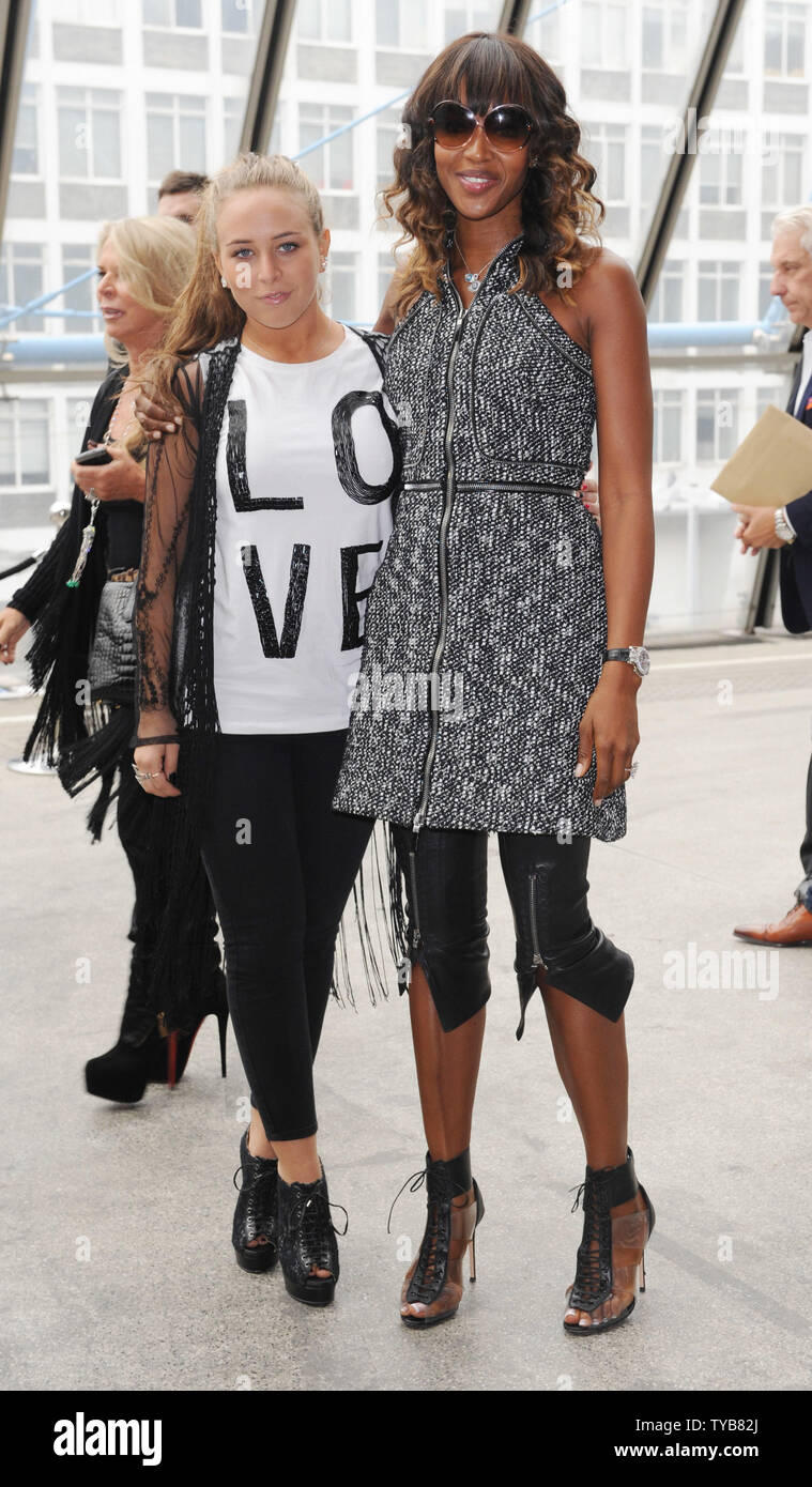 British model Naomi Campbell and businessman Philip Green's daughter Chloe  attend Topshop Unique Spring/ Summer 2012 catwalk show at Fashion Week in  London on September 18, 2011. UPI/Rune Hellestad Stock Photo - Alamy