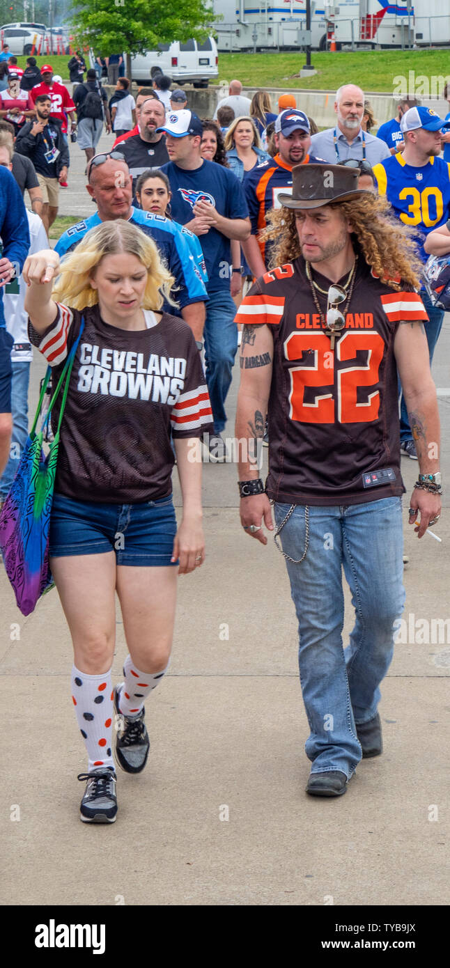 Fans wearing team colours walking to the John Seigenthaler Pedestrian Bridge, NFL Draft 2019, Nashville Tennessee, USA. Stock Photo