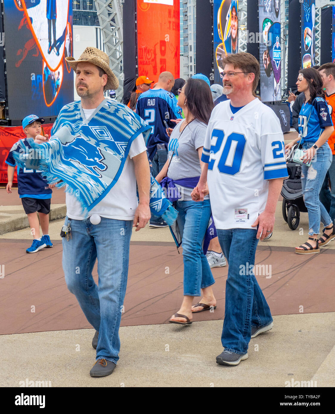 Fans wearing team colours crossing the John Seigenthaler Pedestrian Bridge, NFL Draft 2019, Nashville Tennessee, USA. Stock Photo