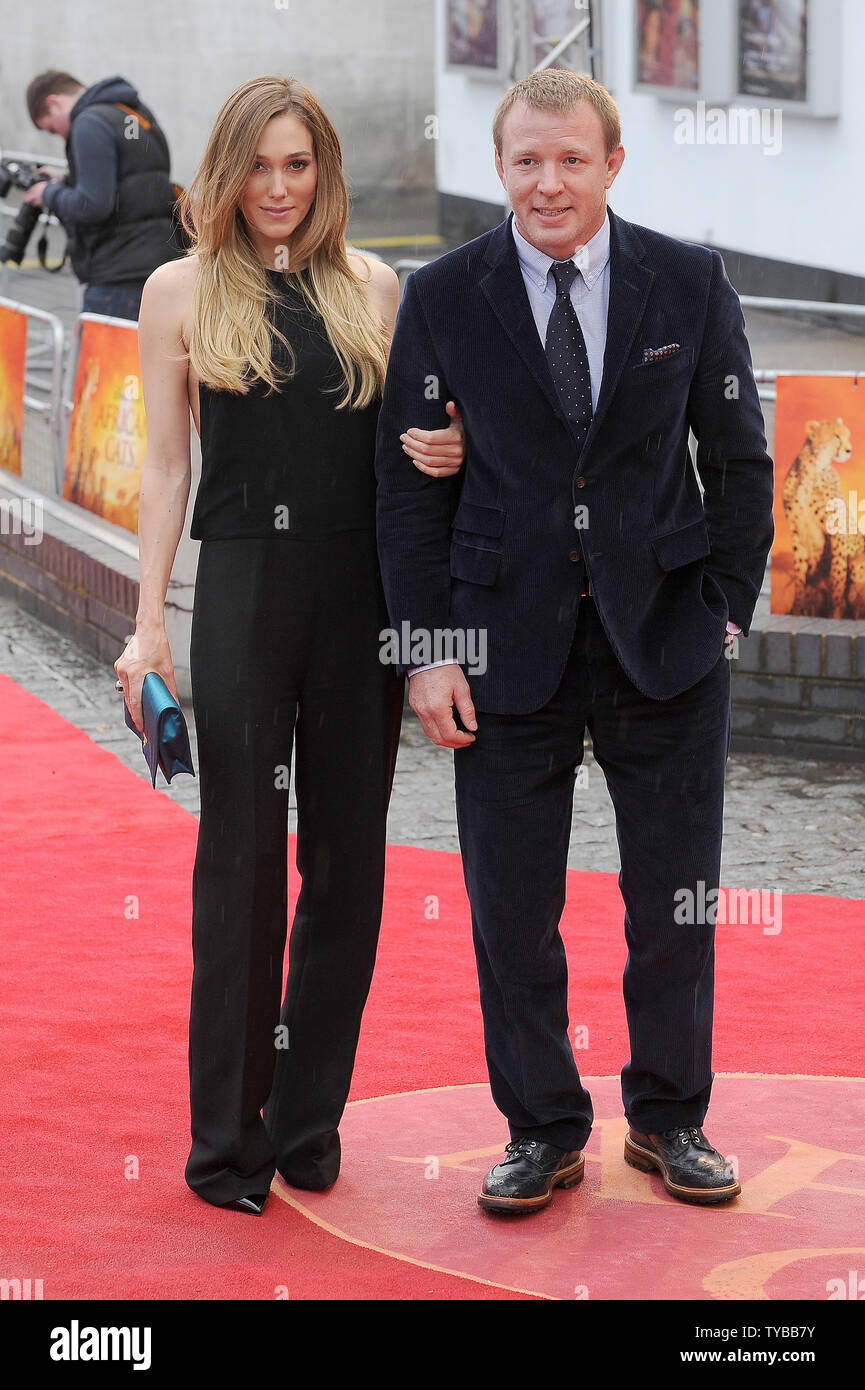 English Screenwriter And Director Guy Ritchie And His English Model Girlfriend Jacqui Ainsley Attend The Uk