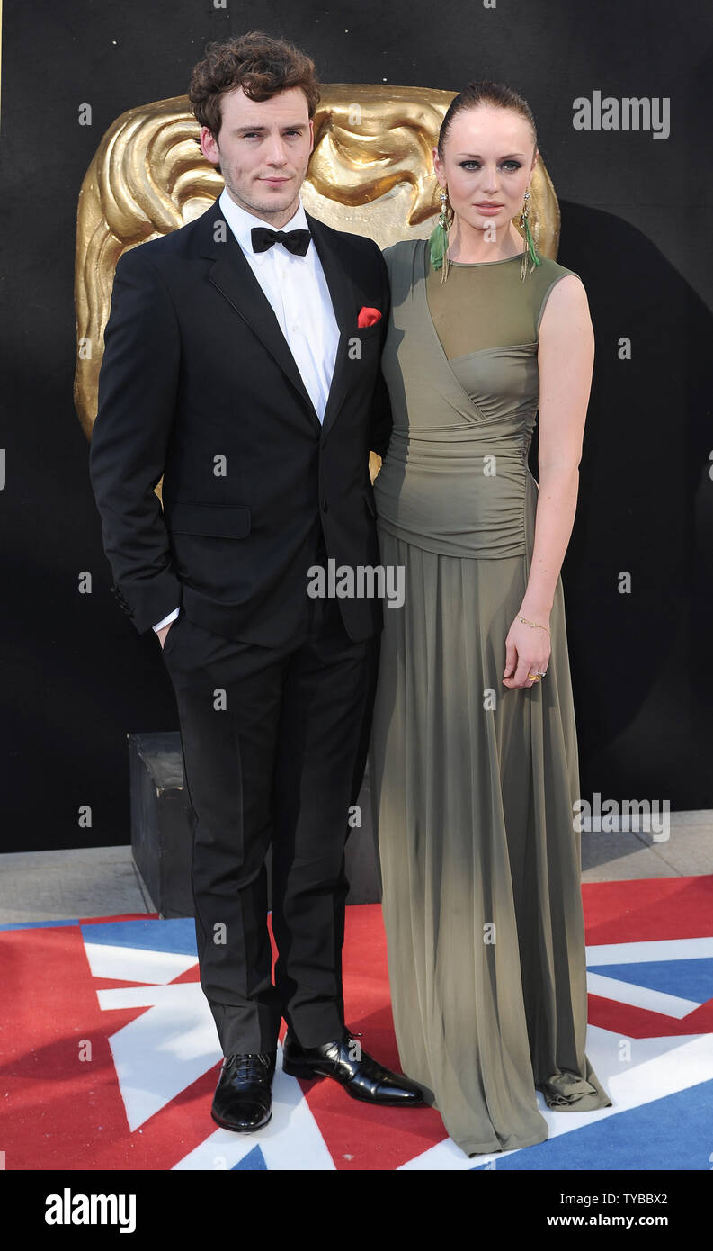 English actor Sam Claflin and his English actress girlfriend Laura Haddock  attend the \, image size:793x1390