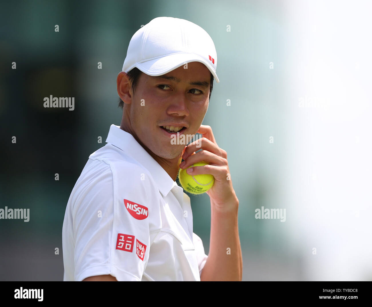 Japan's Kei Nishikori smiles in his match against France's Florent Serra on the fourth day of the 2012 Wimbledon championships in London, June 28, 2012.      UPI/Hugo Philpott Stock Photo