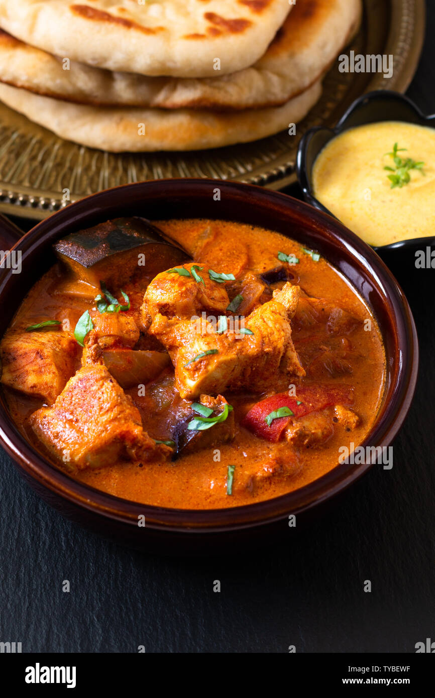 Food concept homemade Tandoori Chicken Masala curry with naan bread and