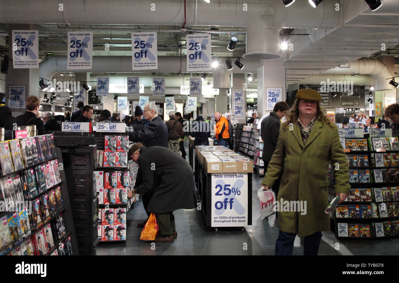 Shoppers look for bargains in the flagship HMV store on London's Oxford Street, January 15, 2013. Britain's last major music and entertainment chain went into administration ninety two years after it opened it's first store. HMV has 239 stores and employs 4,350 people. The administration of HMV follows the announcement of Britain's largest camera retailer Jessops being closed last Thursday with immediate effect after no buyers came forward. Britain's retail landscape remains bleak with many major retailers continuing to slash prices well into the new year.     UPI/Hugo Philpott Stock Photo