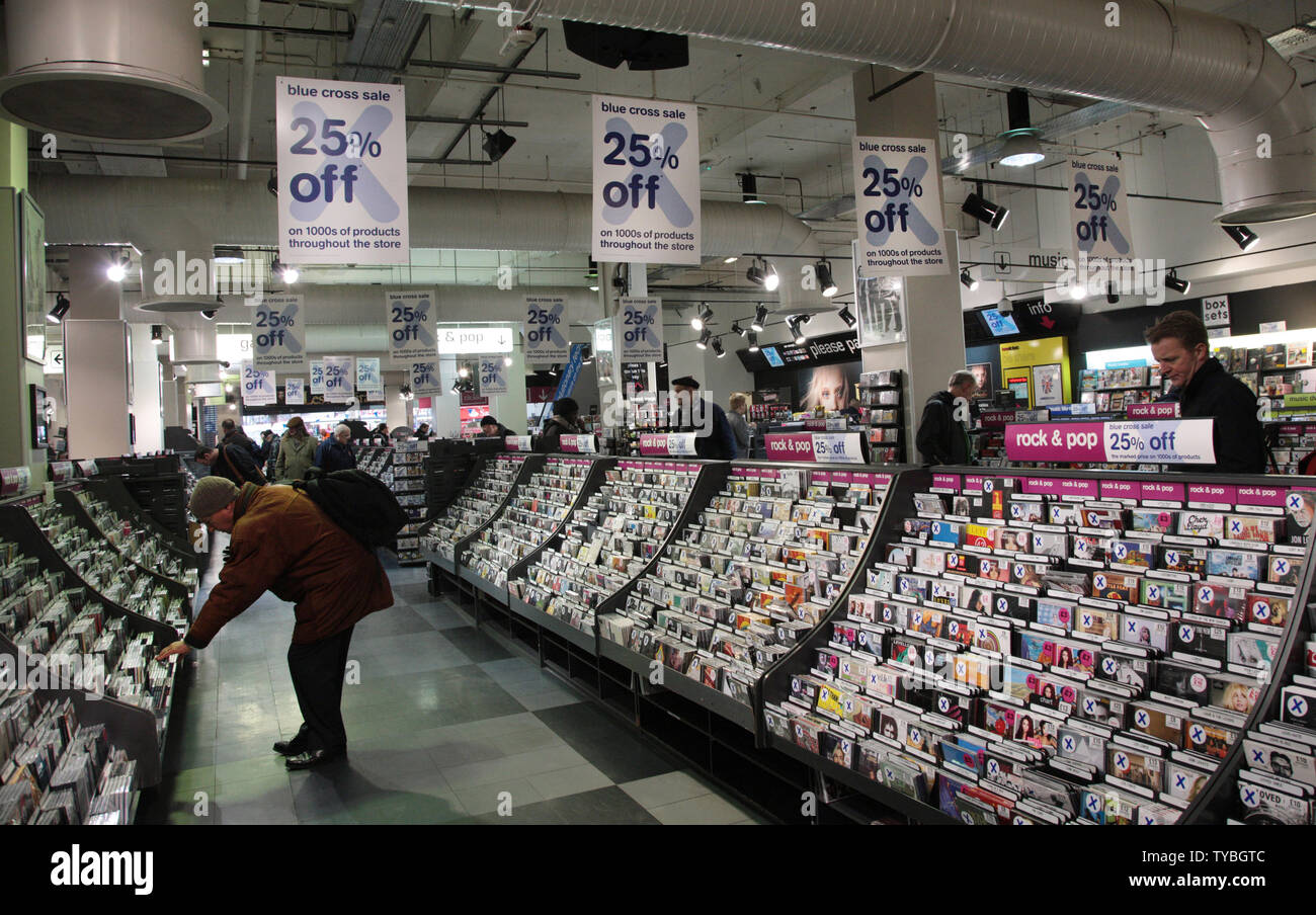 Shoppers look for bargains in the flagship HMV store on London's Oxford Street, January 15, 2013. Britain's last major music and entertainment chain went into administration ninety two years after it opened it's first store. HMV has 239 stores and employs 4,350 people. The administration of HMV follows the announcement of Britain's largest camera retailer Jessops being closed last Thursday with immediate effect after no buyers came forward. Britain's retail landscape remains bleak with many major retailers continuing to slash prices well into the new year.     UPI/Hugo Philpott Stock Photo