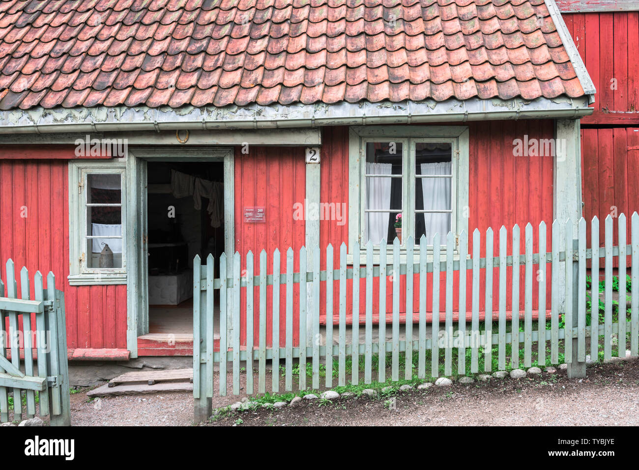 Oslo color, view of a red clapboard house typical of 19th century Norwegian domestic architecture in the Norsk Folkemuseum in Bygdøy, Oslo, Norway Stock Photo