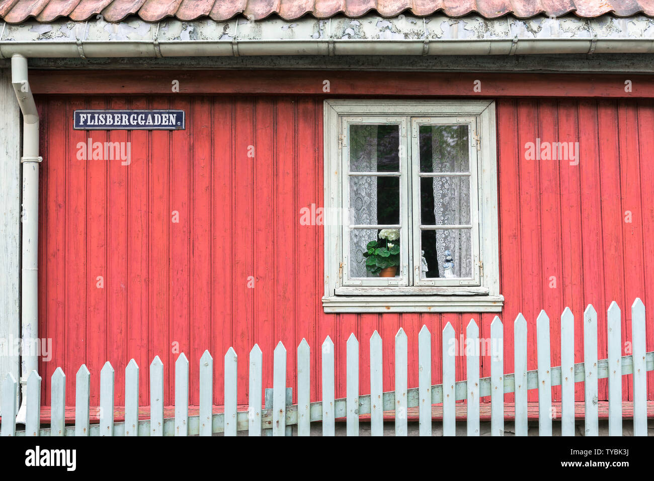 Norway color, view of a red clapboard house typical of 19th century Norwegian domestic architecture sited in the Norsk Folkemuseum in Bygdøy, Oslo. Stock Photo