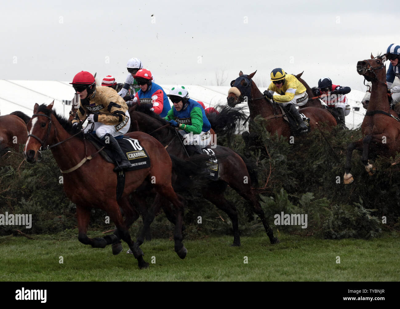 Jockeys jump the famous Chair in the 2014 Crabbies Grand National Race