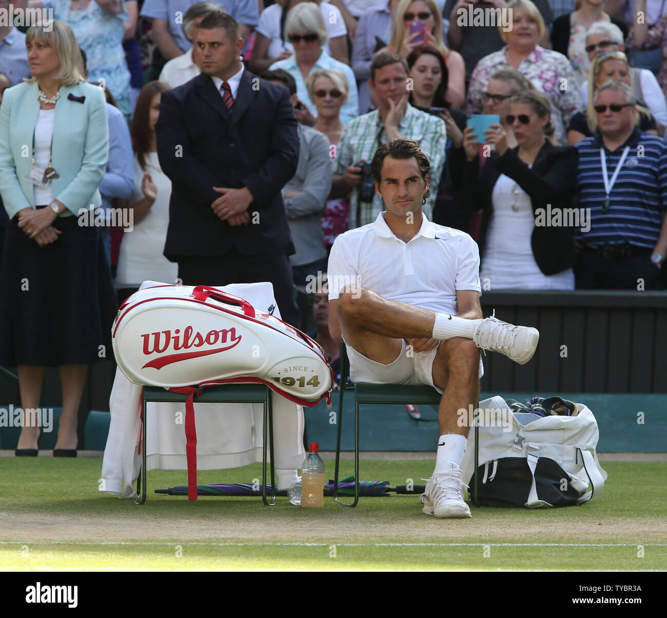 Swiss Roger Federer looks glum after defeat to Novak Djokovic at the Men's  Final of the