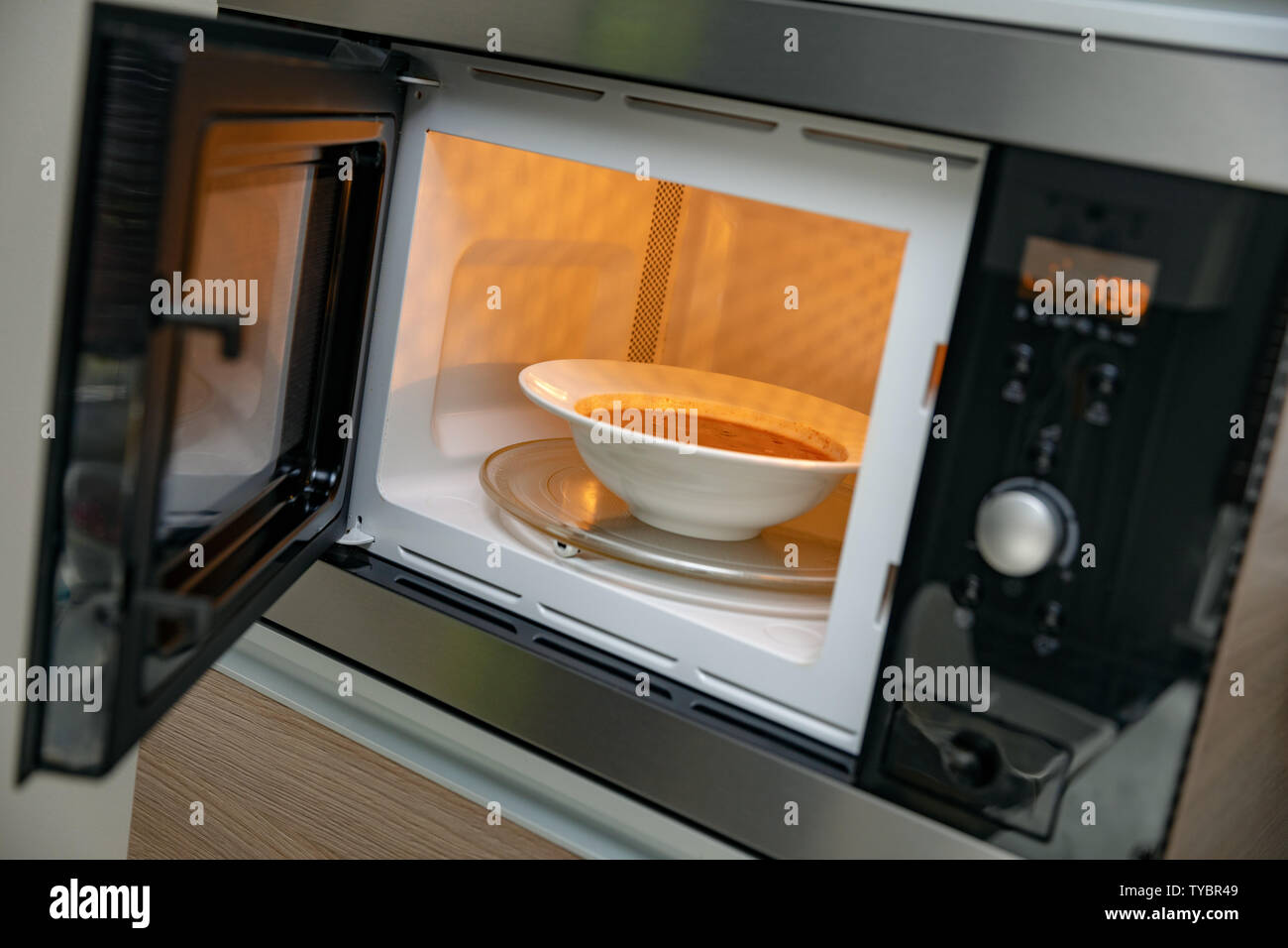 heat up food in microwave oven Stock Photo