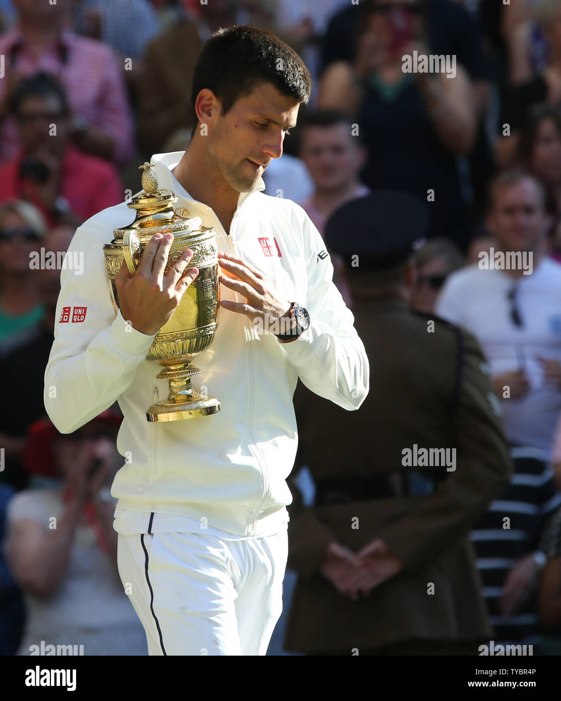 Serbian Novak Djokovic holds the Wimbledon trophy after beating Swiss Roger  Federer at the Men's Final