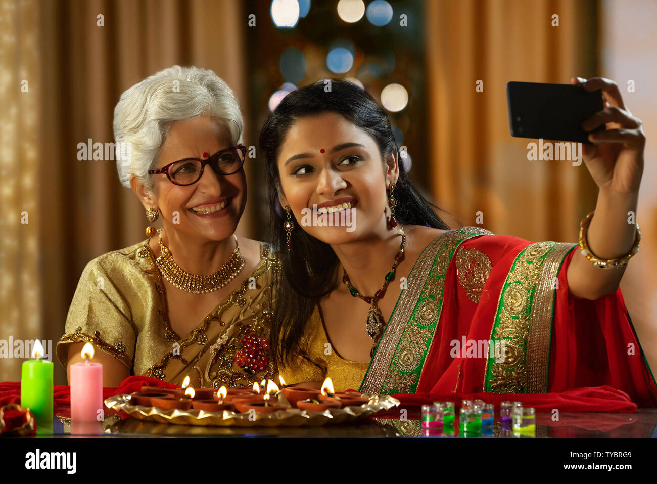 Daughter in law taking a self portrait with mother in law on the