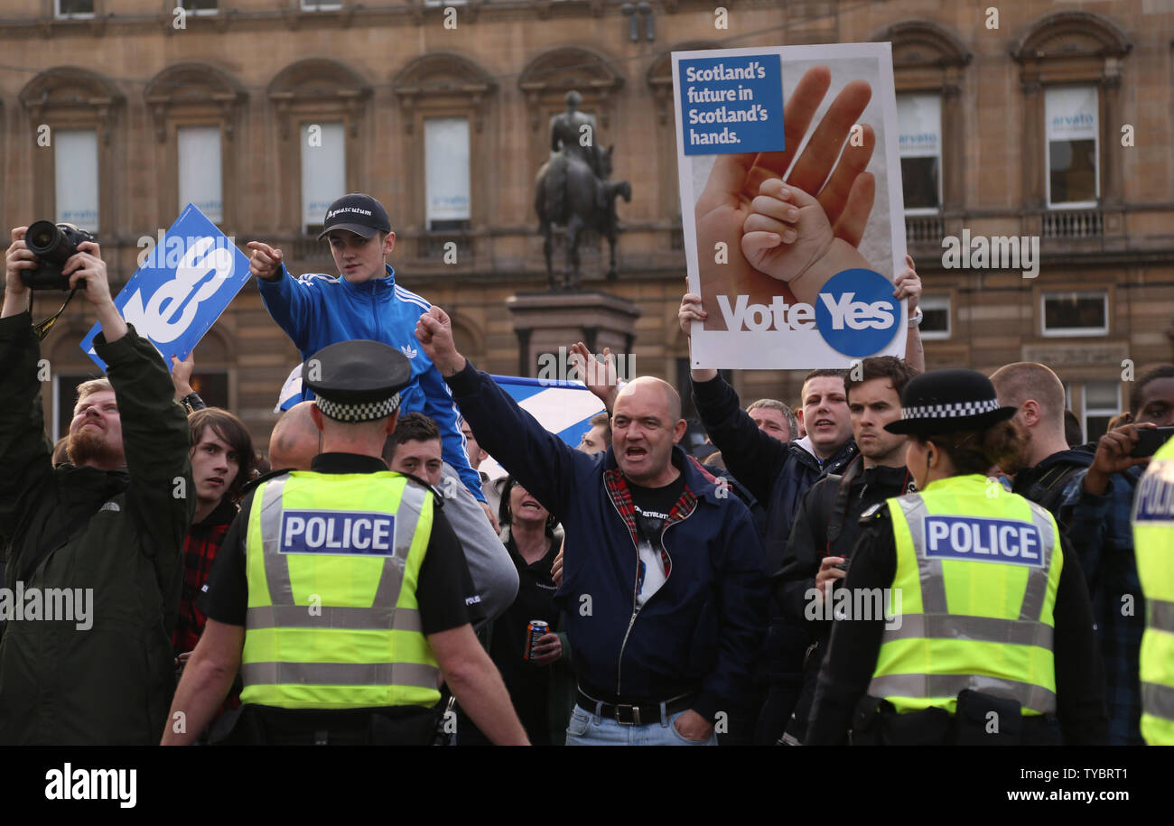 Yes vote campaigners react to Pro-Unionist intimidation in George Sq in Glasgow,Scotland on September 19, 2014. Pro Union voters won the referendum by Fifty-Five percent to Forty-Five percent. The First Minister of Scotland Alex Salmond has resigned today following the referendum vote.      UPI / Hugo Philpott Stock Photo
