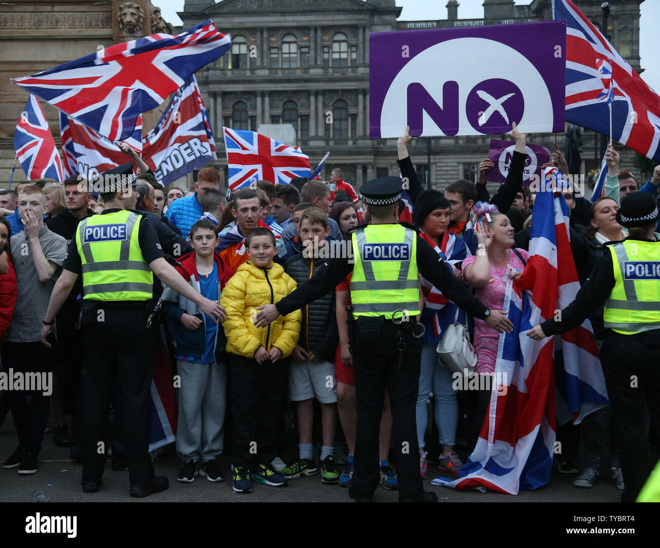 Pro-Unionist voters taunt Yes vote campaigners in George Sq in Glasgow,Scotland on September 19, 2014. Pro Union voters won the referendum by Fifty-Five percent to Forty-Five percent. The First Minister of Scotland Alex Salmond has resigned today following the referendum vote.      UPI / Hugo Philpott Stock Photo