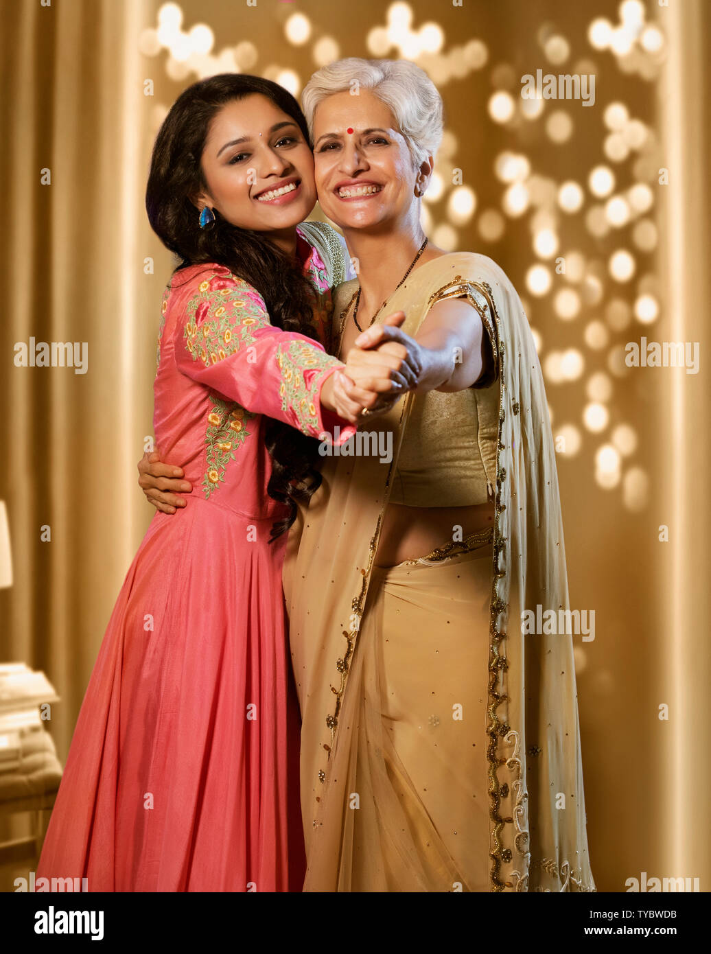 Premium Photo | Portrait of indian mother and daughter with clay diya and  lighting while celebrating diwali festival