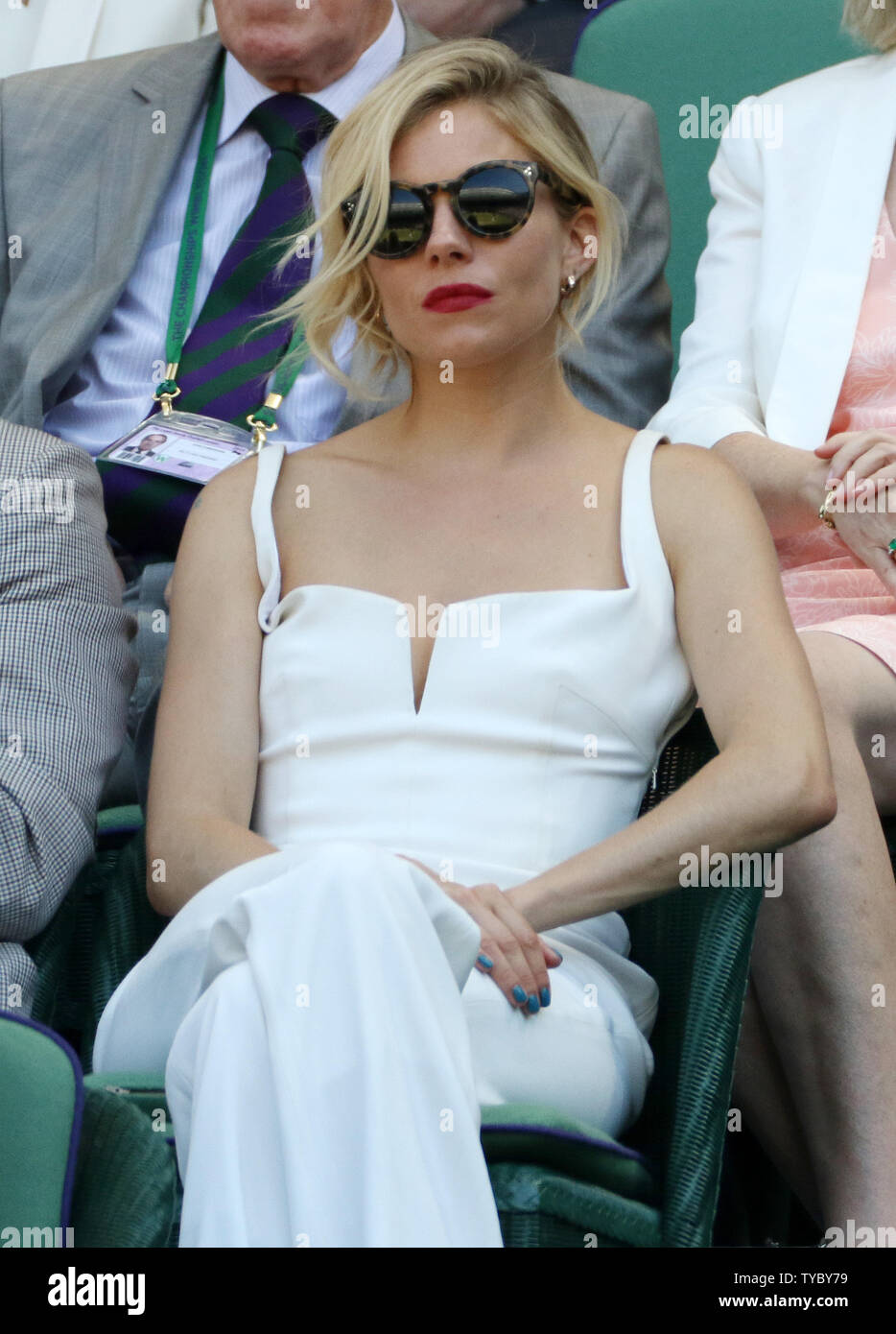 British actress Sienna Miller sits in the royal box during the Men's Semi-Final between Swiss Roger Federer and Great Britain's Andy Murray on day eleven of the 2015 Wimbledon championships, London on July 10, 2015.Federer won the match 7-5, 7-5, 6-4.      Photo by Hugo Philpott/UPI. Stock Photo