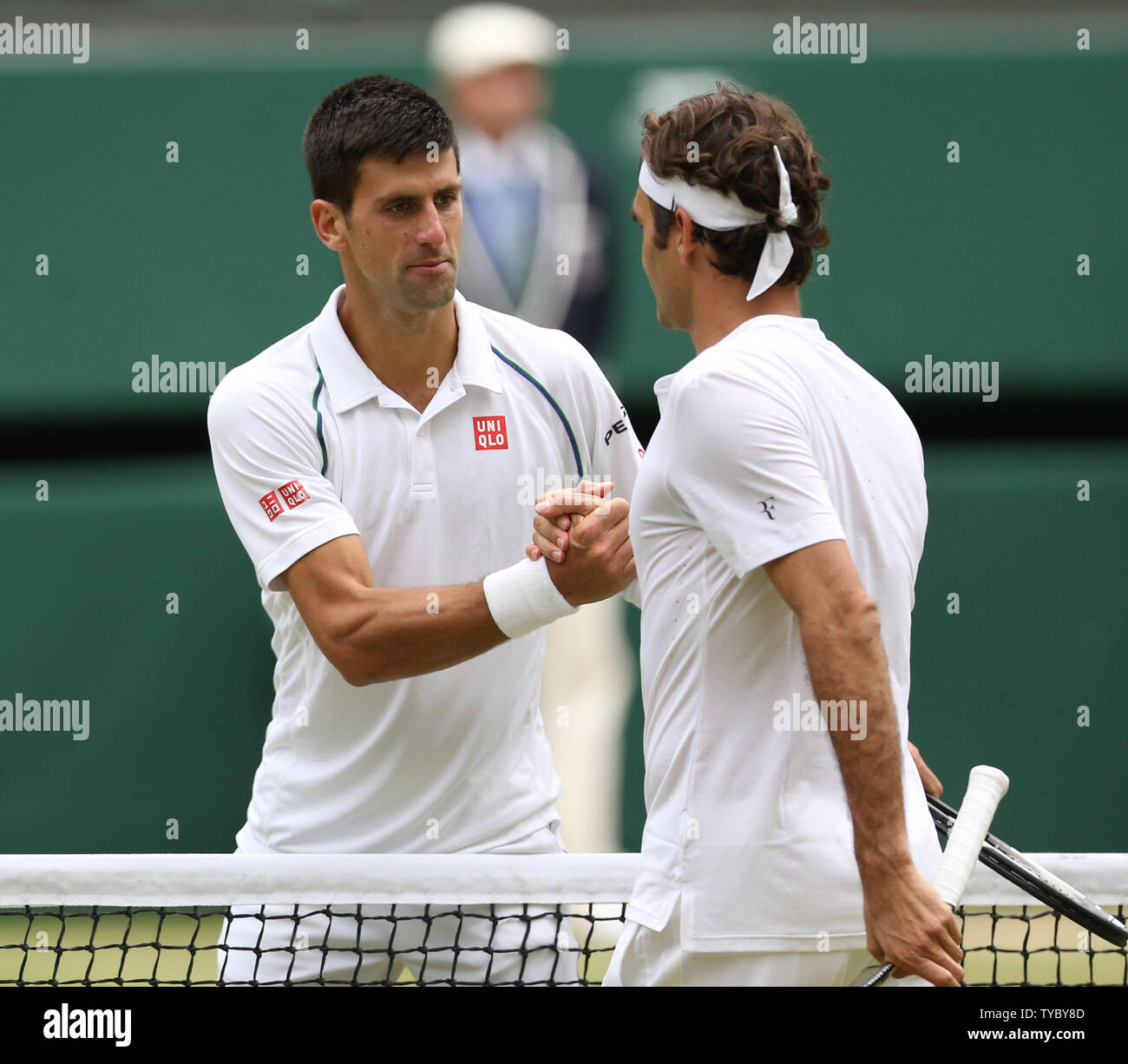 Serbian Novak Djokovic shakes the hand of opponent Roger Federer after  winning the 2015 Wimbledon Men's