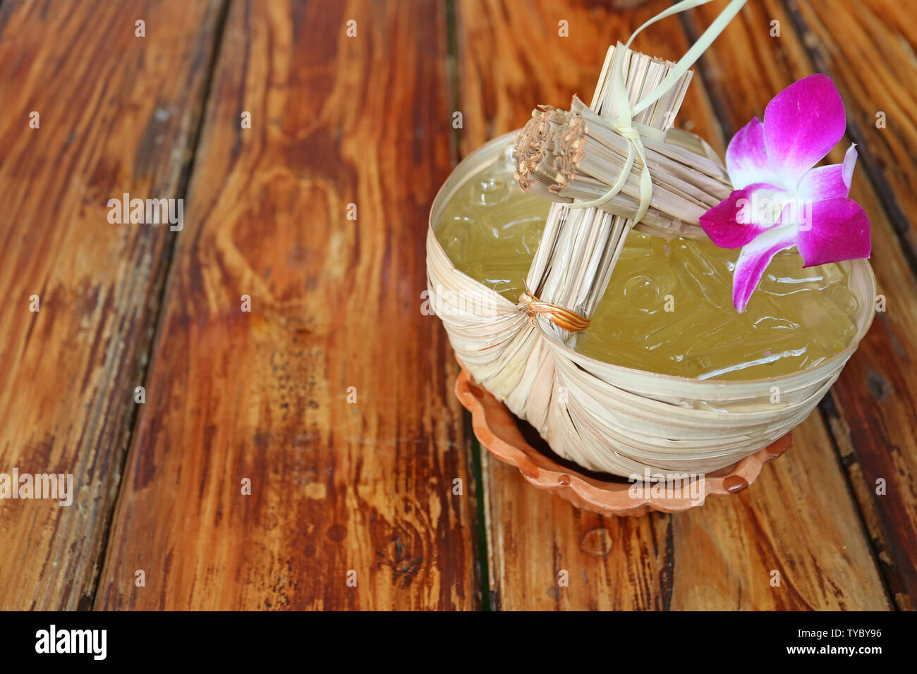 Thai Eastern Style Sweet and Sour Cold Calamansi Citrus Juice Served on Wooden Table Stock Photo