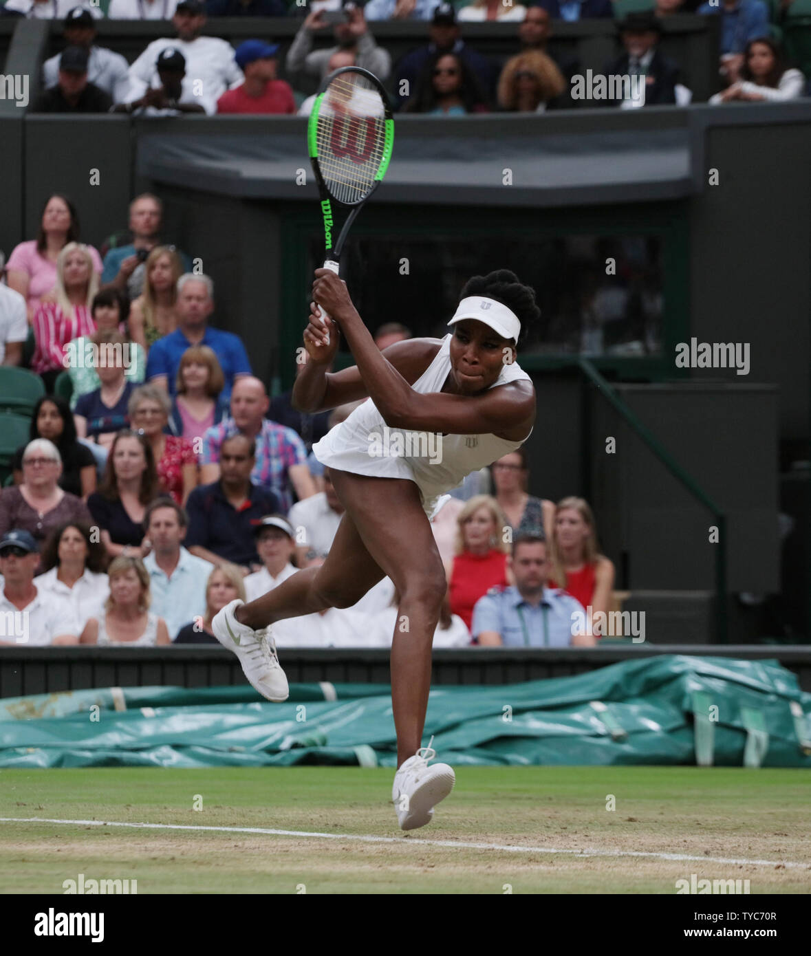 American Venus Williams returns a backhand in her match against Latvian