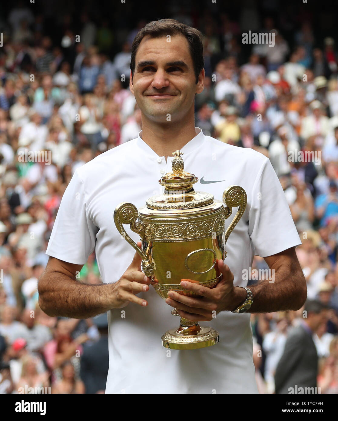 Swiss Roger Federer holds the Wimbledon Singles trophy after victory over  Croat Marin Cilic at the 2017 Wimbledon championships, London on July 16,  2017. Federer beat Cilic 6-3, 6-1, 6-4, to win