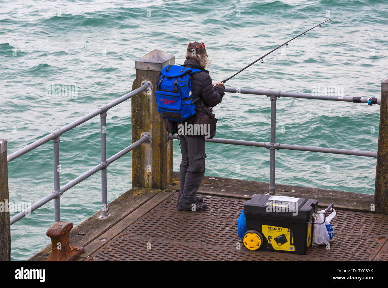 Man fishing off Bournemouth Pier at Bournemouth, Dorset UK in June Stock  Photo - Alamy