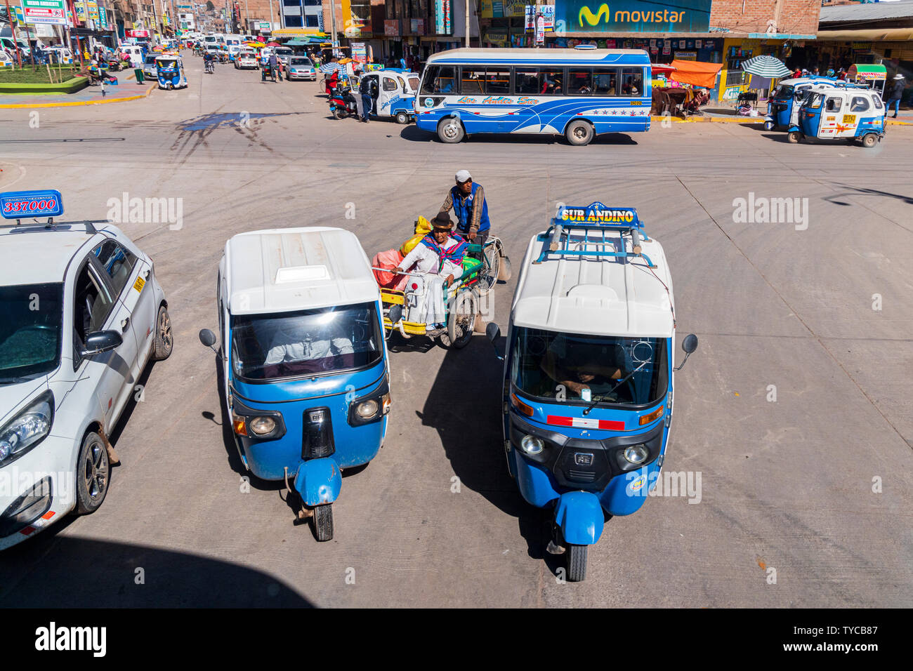 Traffic, tuk tuks and cycle taxi in Puno. Bus trip from Puno to Cusco, Peru, Stock Photo