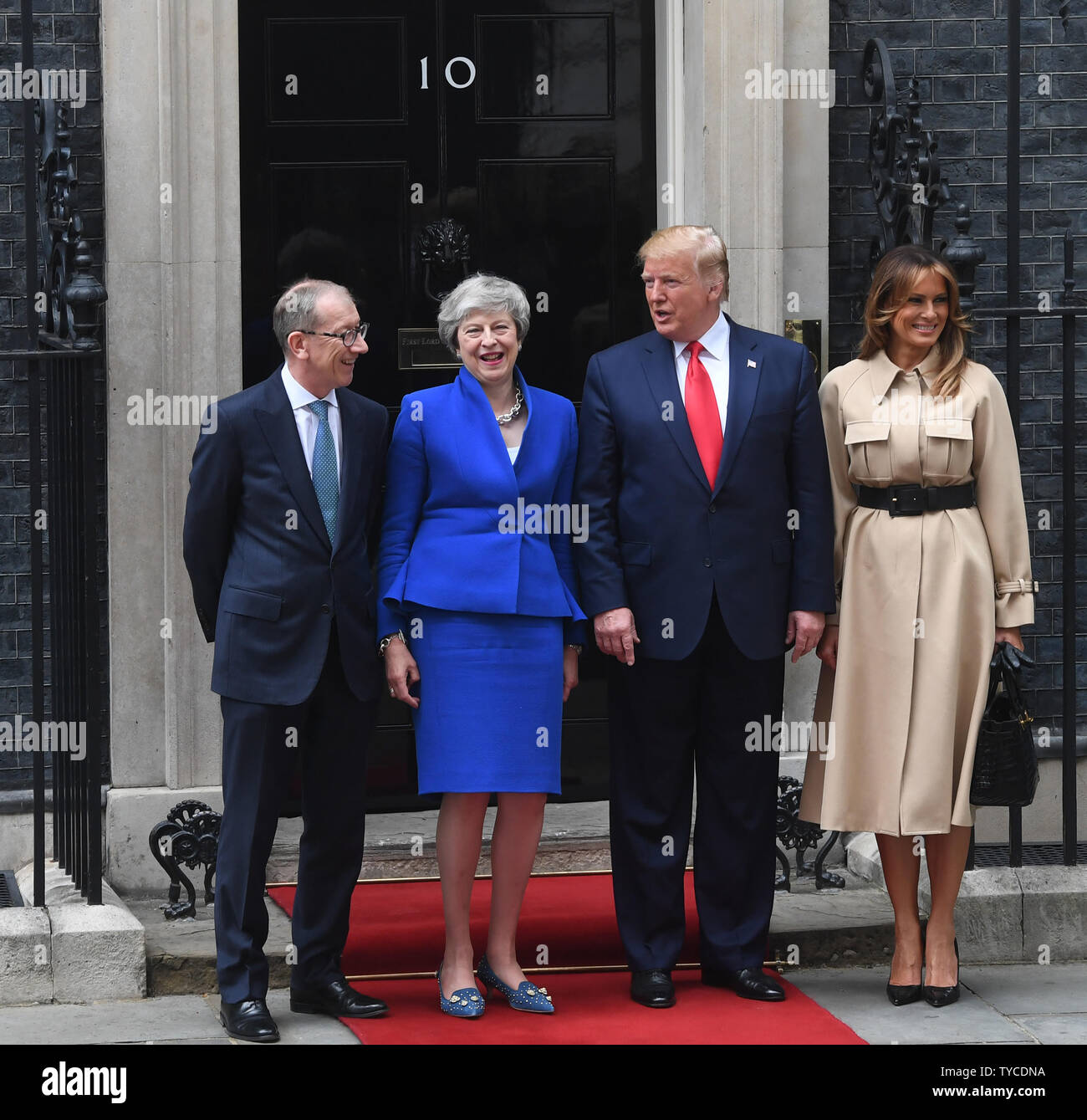 American President Donald Trump and wife Melania Trump pose with British  Prime Minister Theresa May and husband Philip John May at No. 10 Downing  Street during Trump's state visit in London on