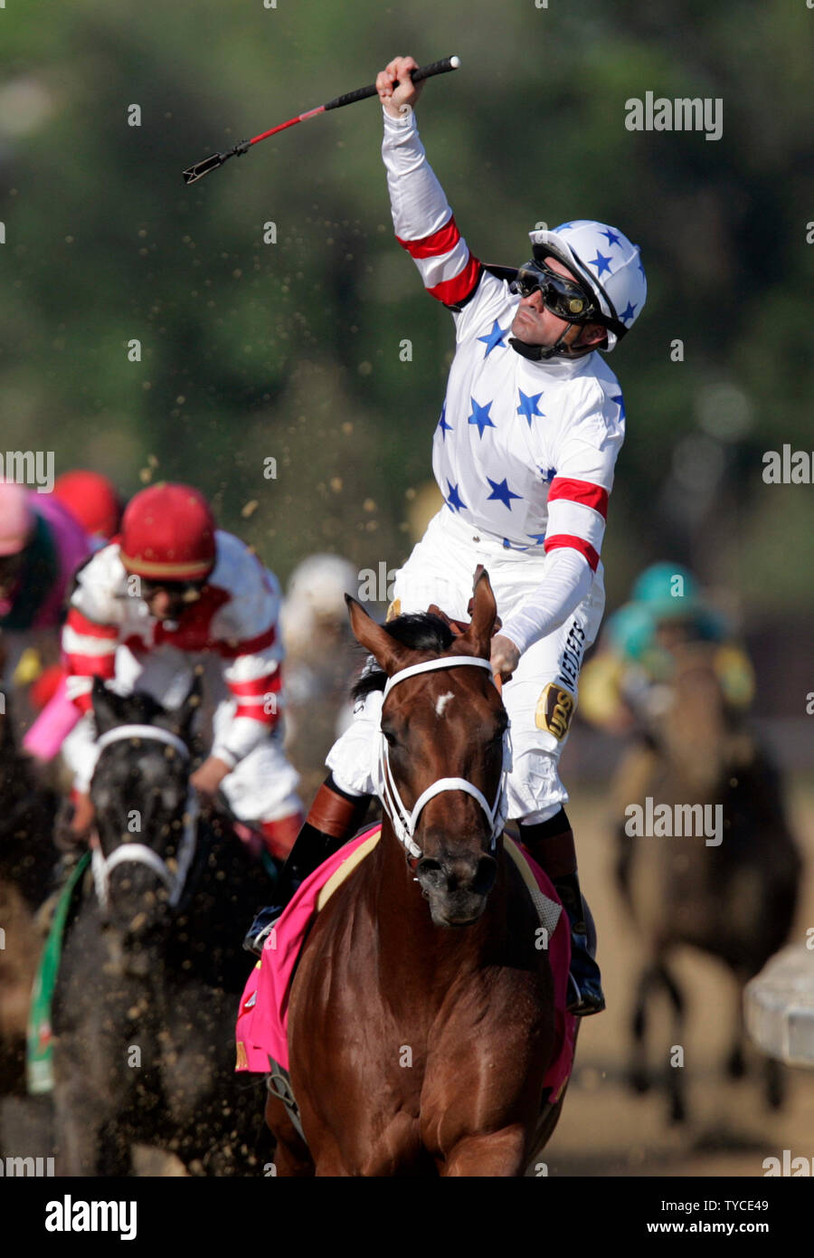 Big Brown, with jockey Kent Desormeaux (C) raises his hand after winning the 134th running of the Kentucky Derby at Churchill Downs in Louisville, Kentucky on May 3, 2008. (UPI Photo/Mark Cowan) Stock Photo