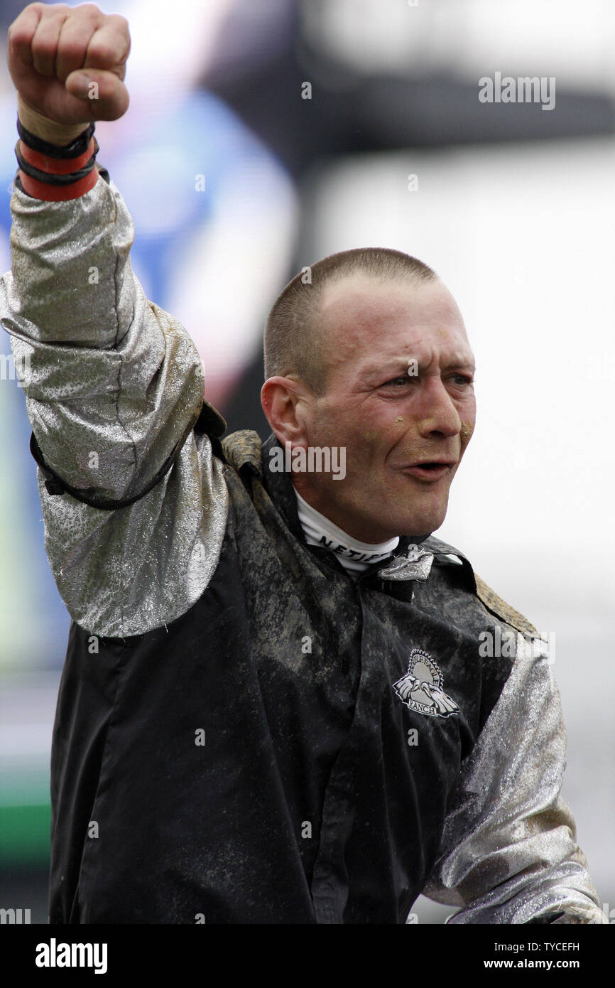 Calvin Borel, aboard Mine that Bird, celebrates winning the 135th