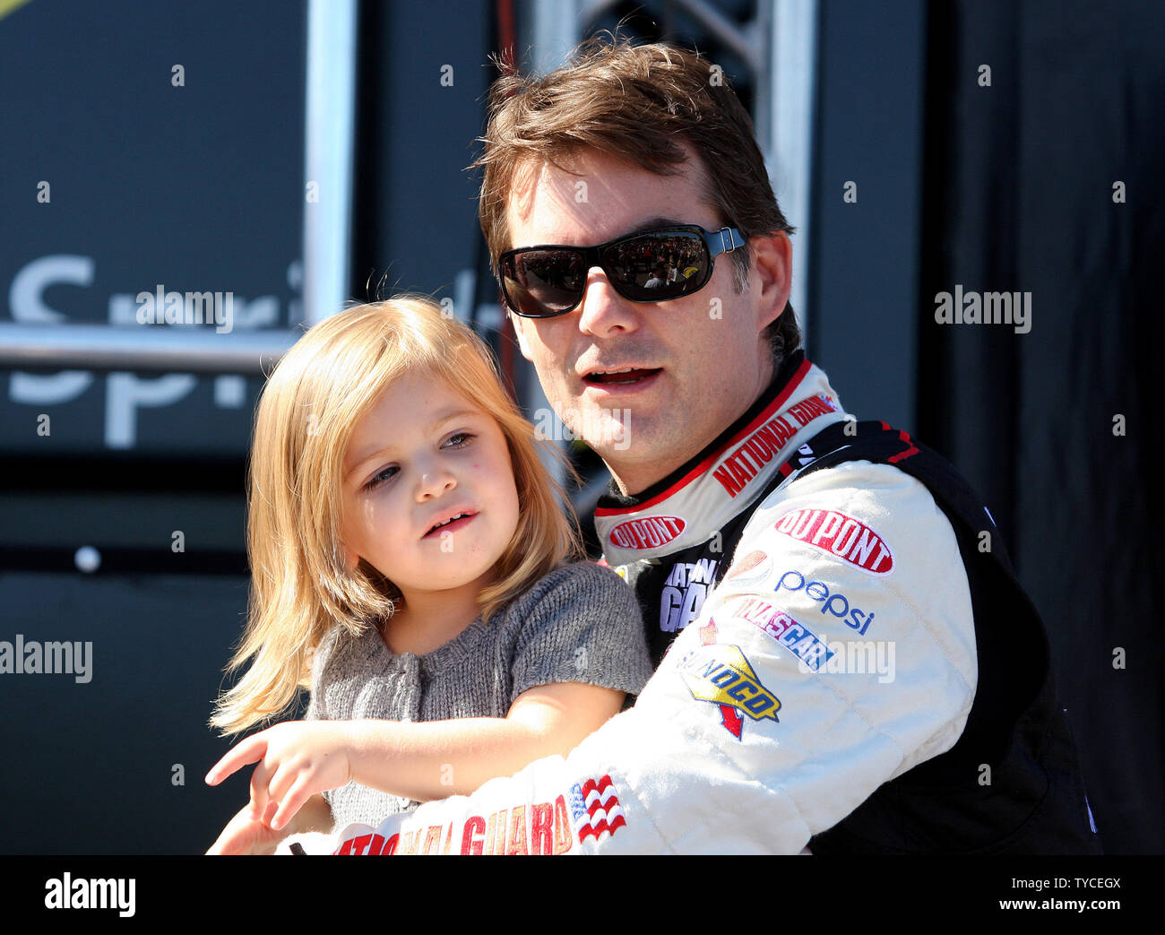 Jeff Gordon holds his daughter Ella Sofia Gordon, prior to driver introductions for the NASCAR Sylvania 300 at New Hampshire Motor Speedway in Loudon, New Hampshire September 20, 2009.  UPI/Malcolm Hope Stock Photo