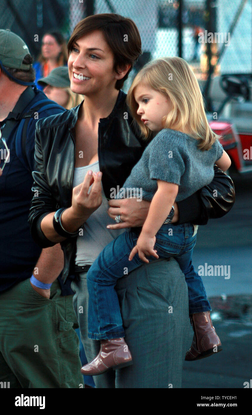 Jeff Gordon's wife Ingrid Vandebosch's holds their daughter Ella Sofia Gordon, after the NASCAR Sylvania 300 at New Hampshire Motor Speedway in Loudon, New Hampshire, September 20, 2009. UPI/Malcolm Hope Stock Photo