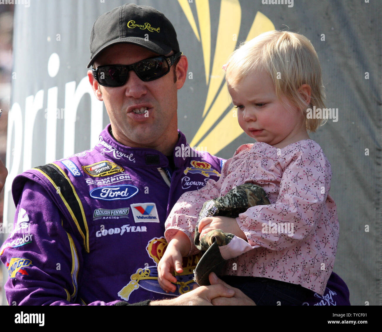 Matt Kenseth and his daughter Kaylin Nicola Kenseth, wait back stage for the start of driver introductions for the NASCAR Sprint Cup Series Sylvania 300 at New Hampshire Motor Speedway in Loudon, New Hampshire on September 25, 2011.  UPI/Deborah Hope Stock Photo