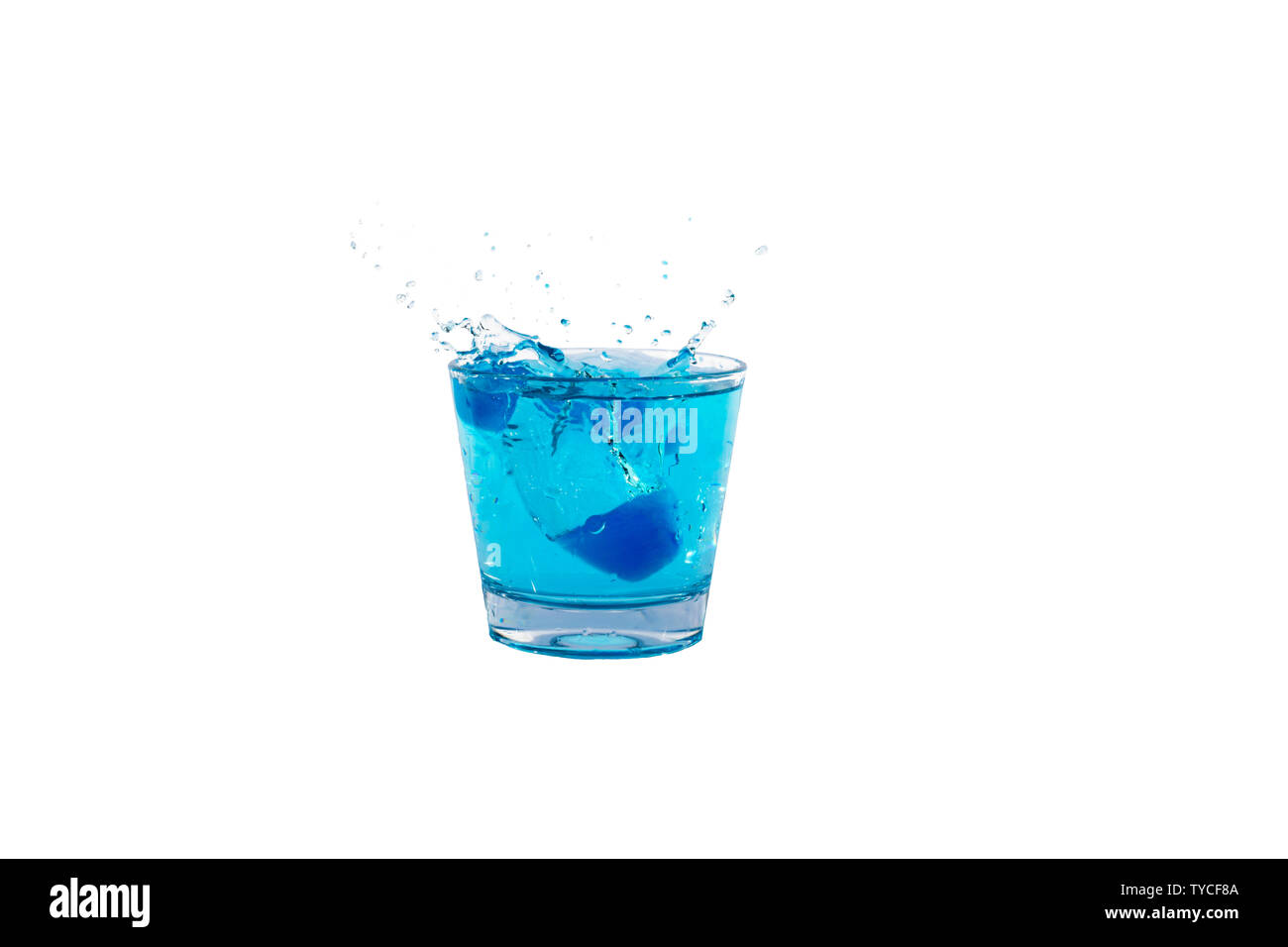 Blue ice cubes splashing into glass of water Stock Photo - Alamy