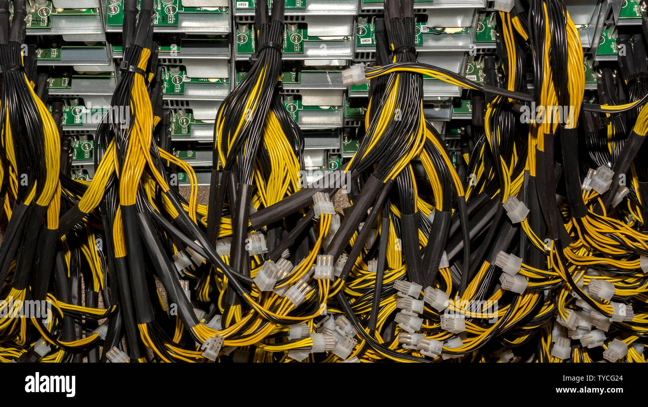 Stack of power cables from power supply unit Bitcoin Pc motherboard
