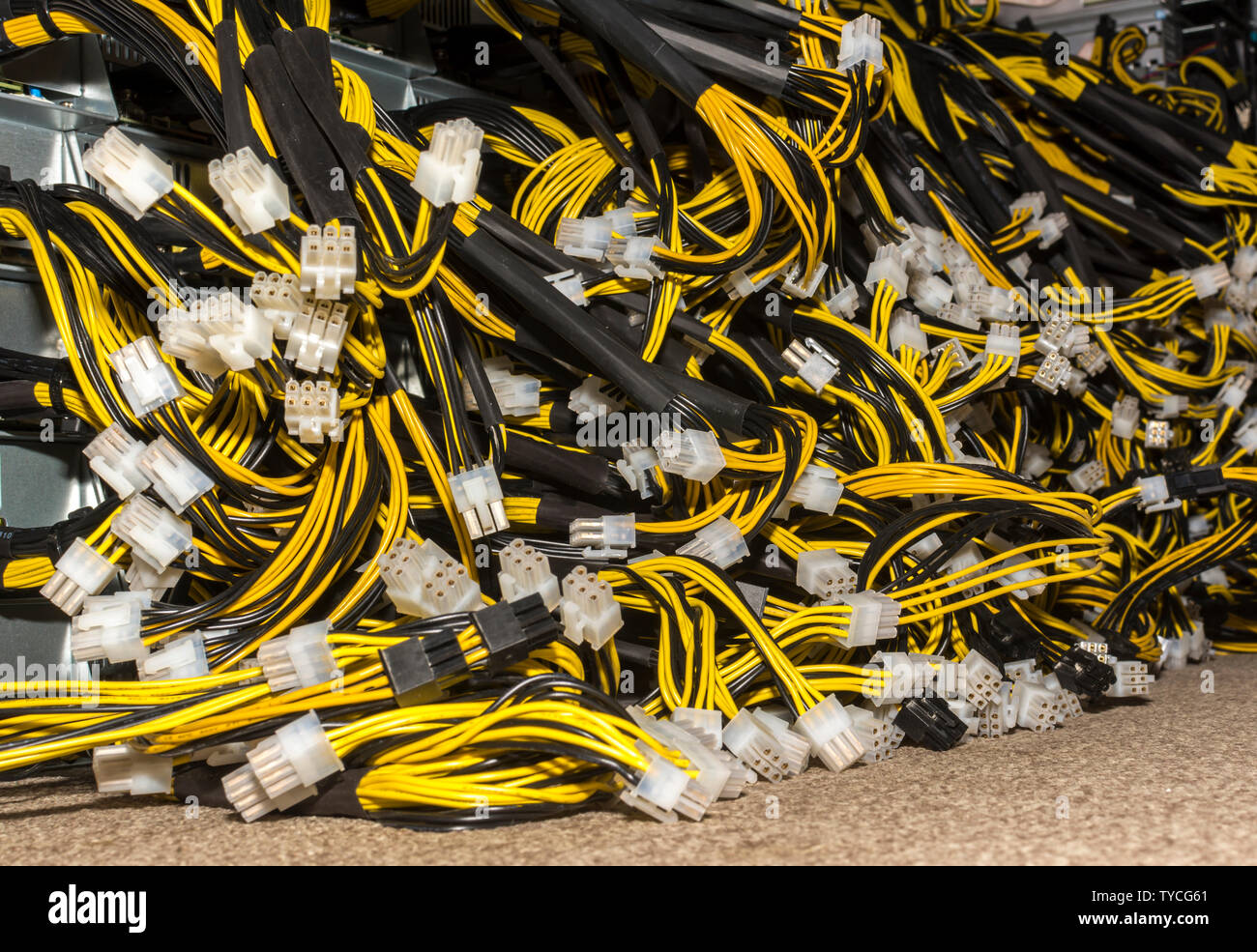 Stack of power cables from power supply unit Bitcoin Pc motherboard