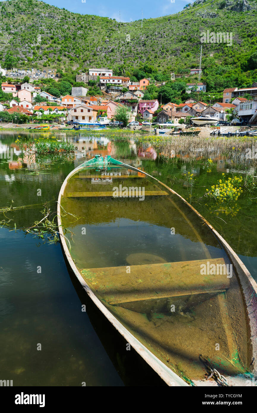 Small village reflecting in the water, near Albanian border, Montenegro Stock Photo
