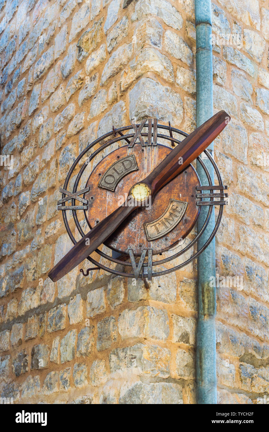 Clock on wall, Budva old city, Montenegro Stock Photo