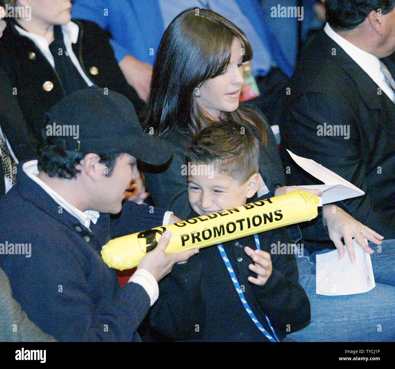 Famed boxer and promoter Oscar DeLa Hoya plays with his son Jacob, with