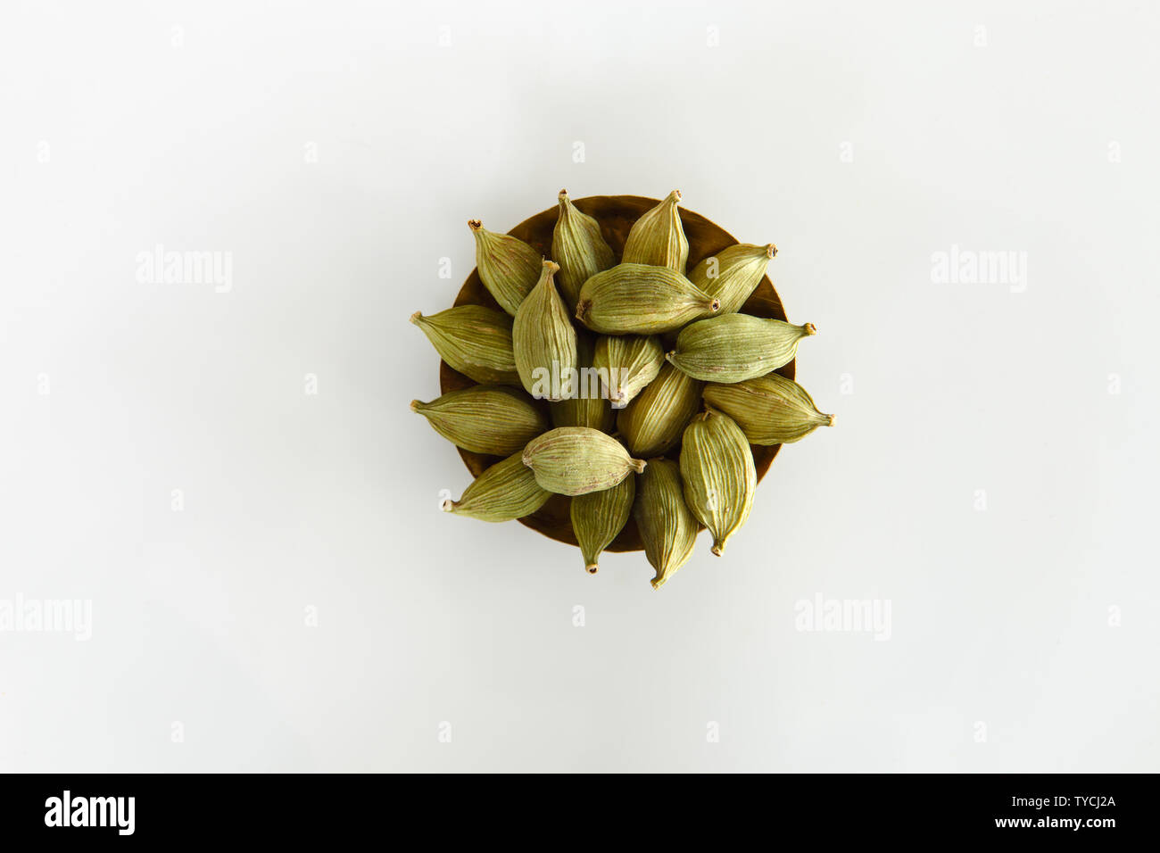 High angle view of green cardamom in a bowl Stock Photo