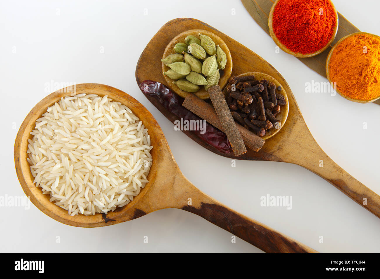 Assorted spices with white rice Stock Photo - Alamy