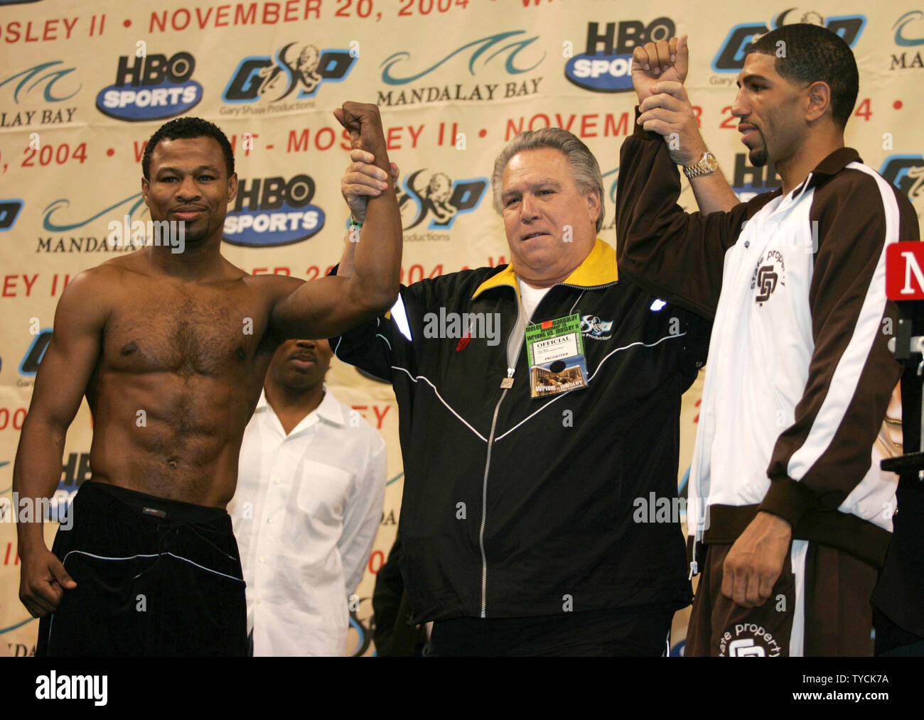 Sugar Shane Mosley (left) and Winky Wright, stand with promoter Gary Shaw at the weigh-in for their title fight at the Mandalay Bay in Las Vegas on November 19, 2004.   (UPI Photo/Roger Williams) Stock Photo