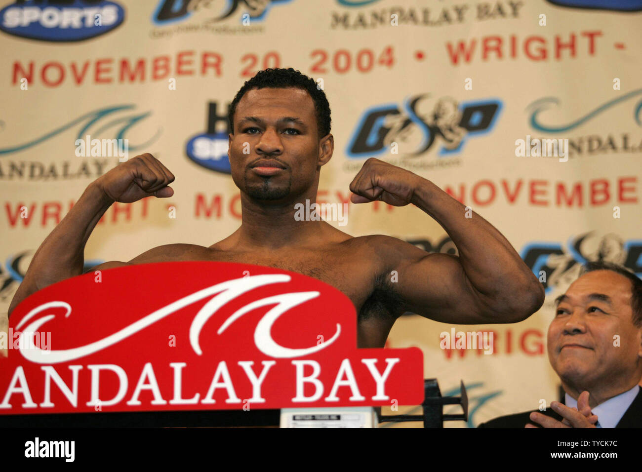 Sugar Shane Mosley shows off his muscles as he weighs in at 154 pounds for his November 20 title fight with Winky Wright at the Mandalay Bay in Las Vegas on November 19, 2004.   (UPI Photo/Roger Williams) Stock Photo