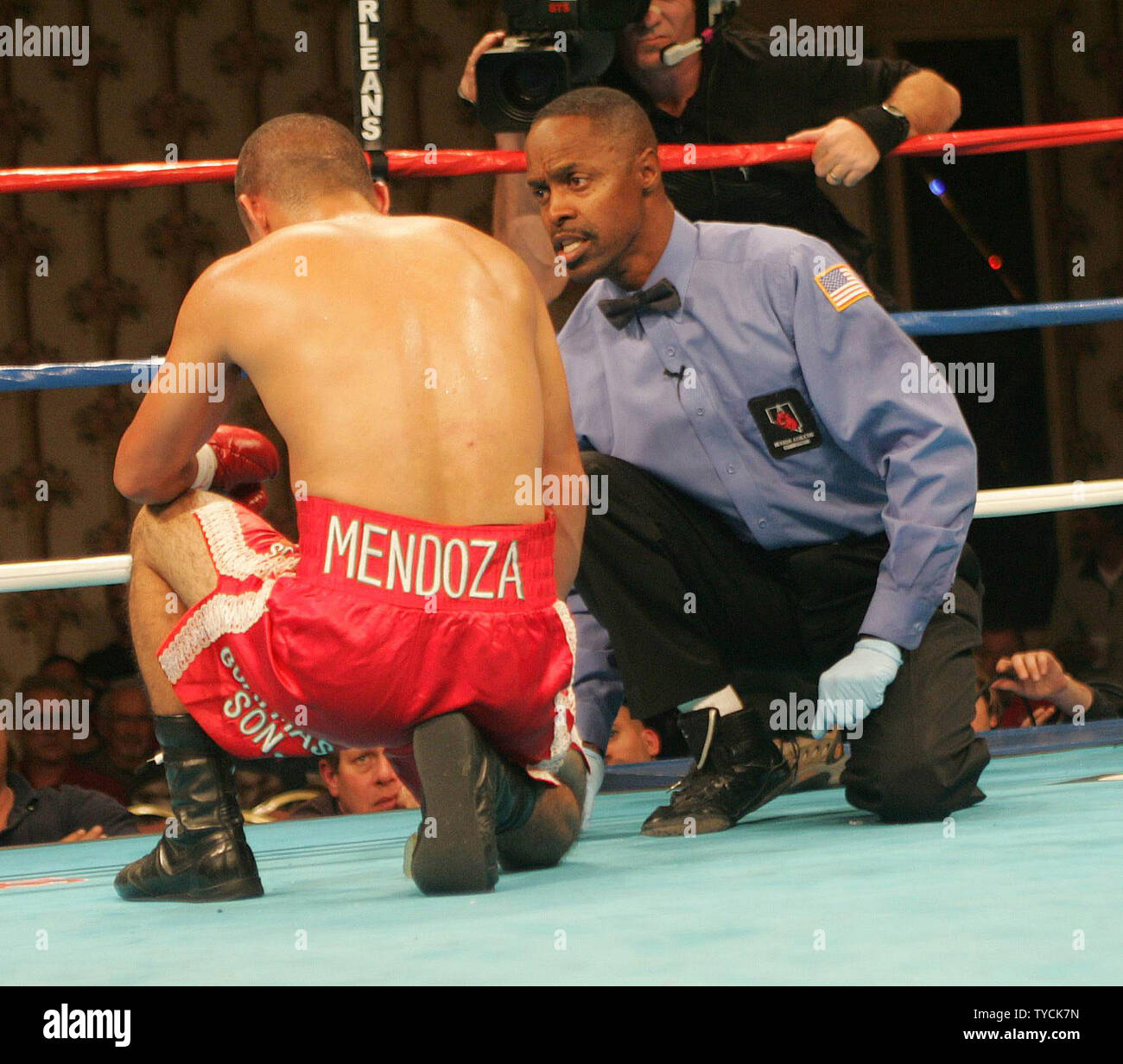 Referee Ken Bayliss counts over Trinidad Mendoza of Tijuana Mexico in the  6th round of his fight with Featherweight champion Adam Carrera of  Cathedral City CA at the Orleans Casino in Las