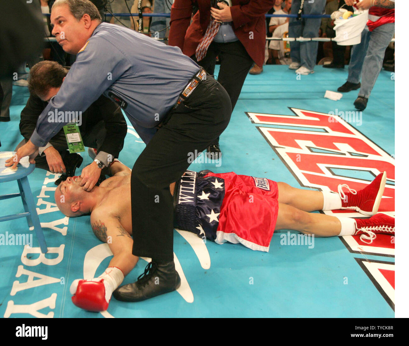 Referee Bob Byrd stands over unconcious heavyweight contender Jeremy