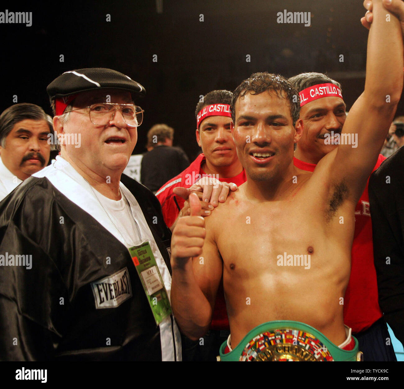 Lightweight champion Jose Luis Castillo celebrates with trainer Miguel