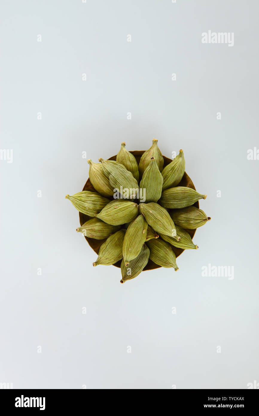 High angle view of green cardamom in a bowl Stock Photo