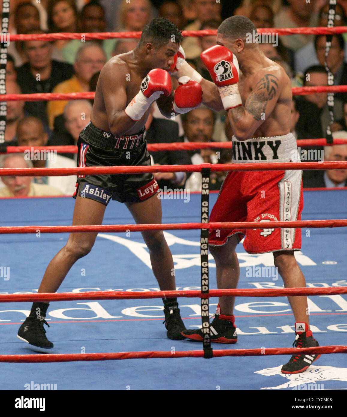Undisputed Jr. Middleweight Champion of the World, Ronald 'Winky' Wright (L) of St. Petersburg,  FL hits former multiple weight champion Tito Trinidad of Puerto Rico with a right while winning a 12 round decision at MGM Grand in Las Vegas, May 14, 2005. Trinidad barely won a round in the fight. (UPI Photo/Roger Williams) Stock Photo